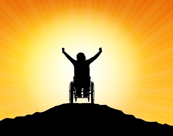 Silhouette of a woman in a wheelchair with her arms raised in success -strengths-based approaches training course image