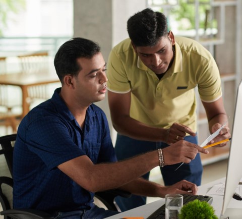 A Manager a co-worker discussing a task - Delegate Don't Dump Training Course