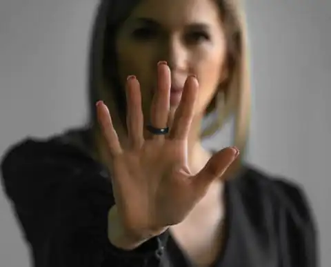 Image of a woman holding her hand out as a stop sign - safeguarding adults training course