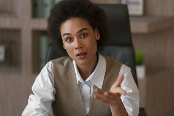 A young female office working expressing her views - Develop your Assertiveness Training Course