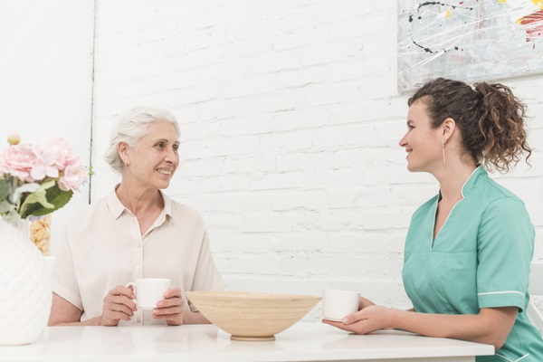 Senior lady and female nurse having coffee together - picture for supervision Skills Training Course